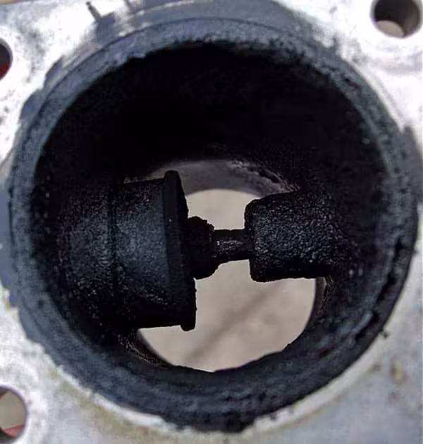 EGR valve before cleaning, the bore and valve stem completely lost in carbon build-up