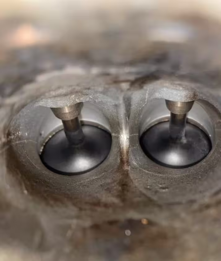 The same two intake valves after walnut blasting, the metal clean